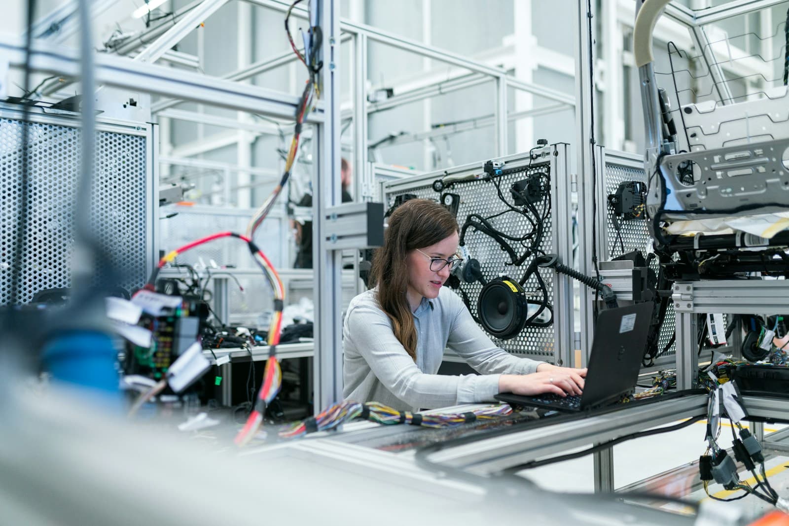 Professional engineer conducting quality assessment in an industrial facility
